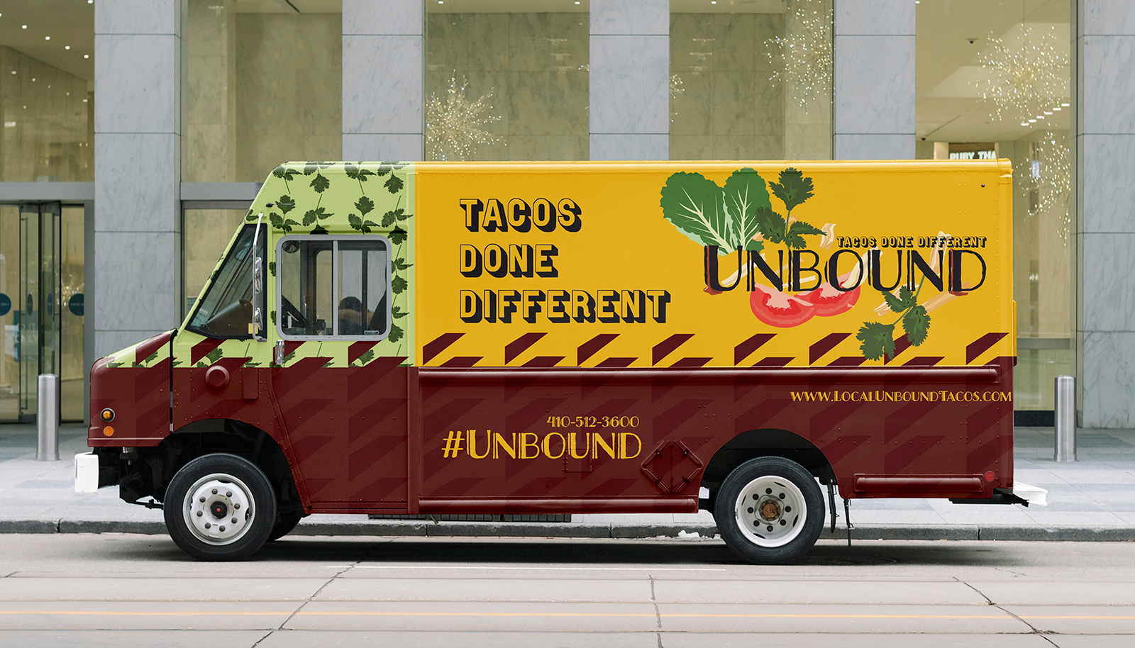 Photo of a food truck parked on a city street, featuring a colorful taco-themed design with the text “Tacos Done Different” and “Unbound.”